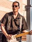 A person playing a guitar

Description automatically generated with medium confidence